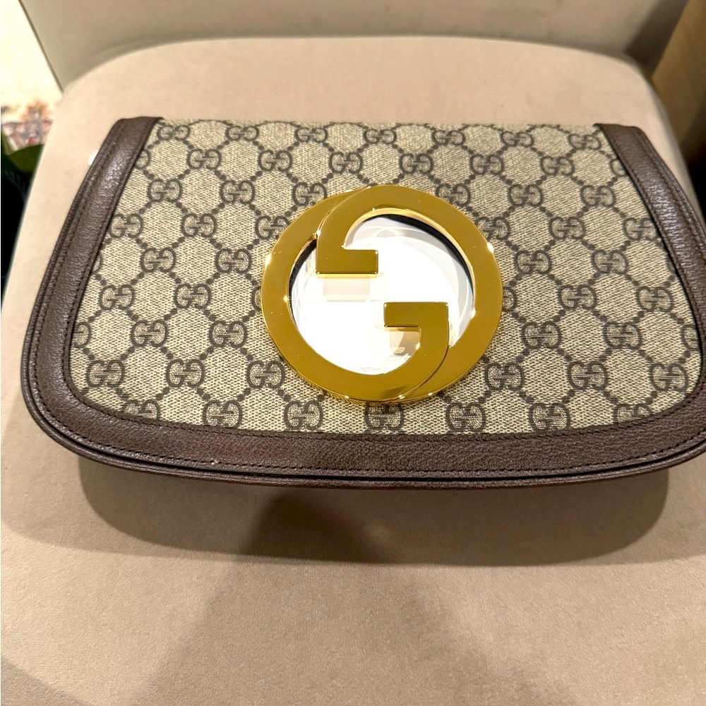 Gucci Beige and Brown Patterned Clutch with Gold Emblem